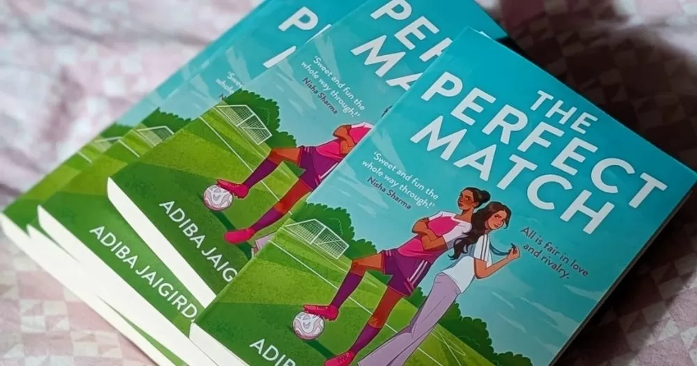 The cover of a sapphic sports romance book, The Perfect Match.