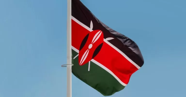 A Kenyan flag against a blue sky.
