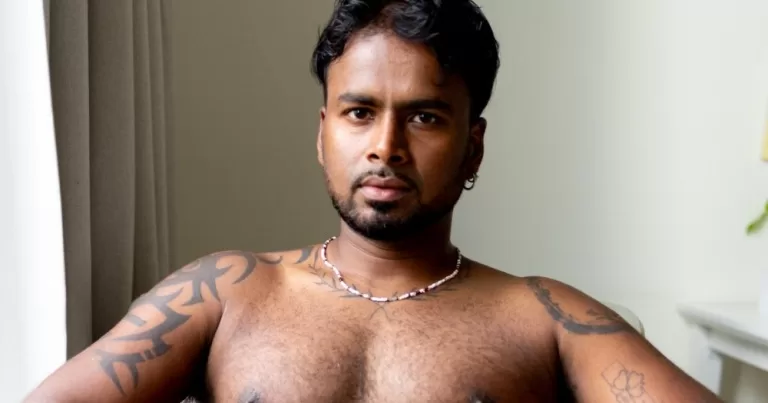 A topless man poses for the camera. His image is being featured in the lates issue of Elska Magazine.