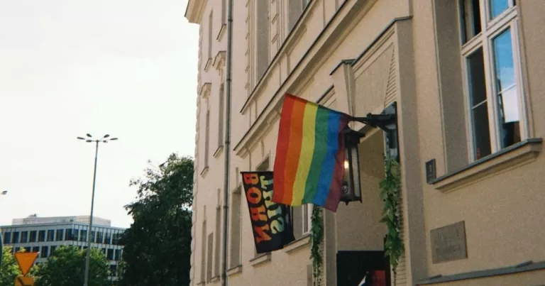A Pride flag hangs outside a building in Poland. This article is being used to represent a story about same-sex marriage in Poland.