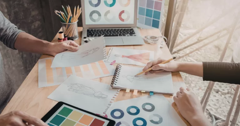 Image shows a group of designers working together. This article covers Waterford Pride and their new artist bursary