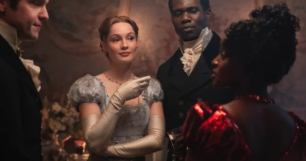 Francesca Bridgerton with her husband John, looking at her queer love interest in her season's storyline, Michaela Stirling.