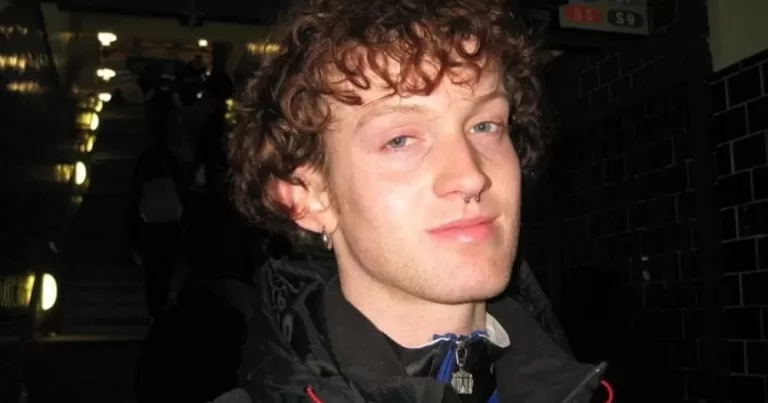 A photo of Joe Drennan smiling slightly.