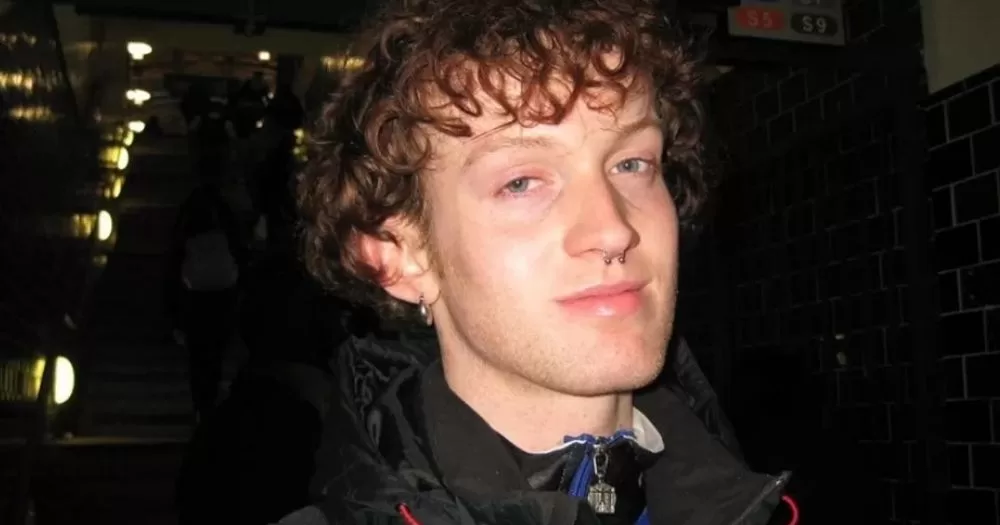 A photo of Joe Drennan smiling slightly.