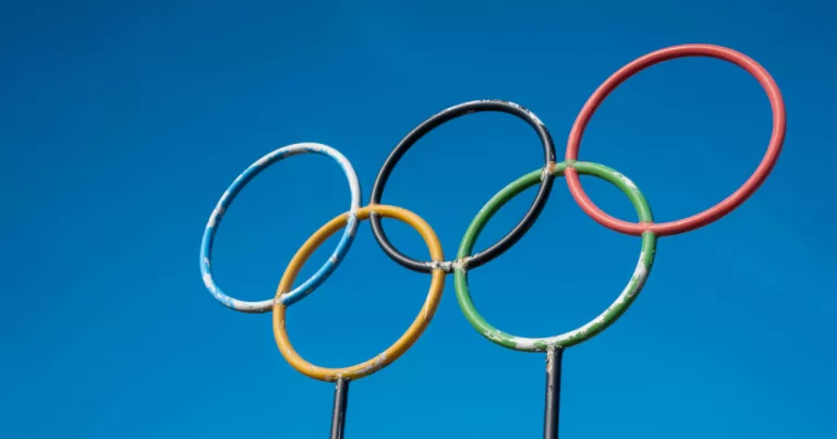 Olympics policy banned transgender athletes. A sign of the Olympic rings.