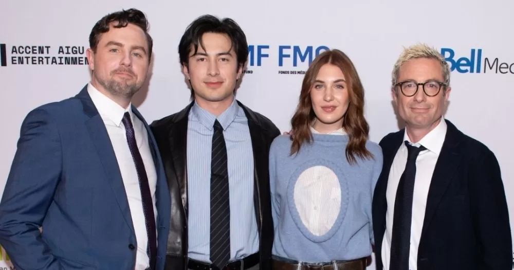 Hudson Williams (second from the left) and Jacob Tierney (right) on a red carpet. Tierney speaks up on racism from Heated Rivalry fans.