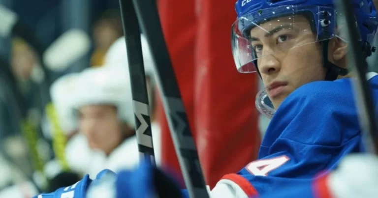 Shane Hollander, one of the protagonists of Heated Rivalry who is autistic, looking at the hockey rink during a match.