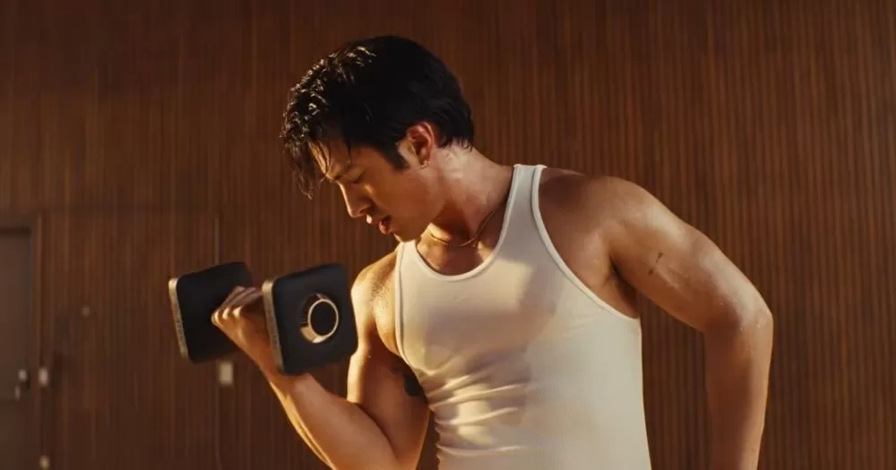 Hudson Williams is lifting weights in a new ad for Peloton.