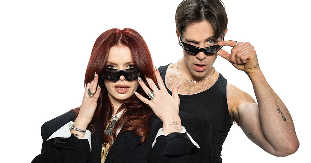 Press photo of Amy Spalding and Gareth Valentino, the hosts of the new I Kissed A Boy/Girl spin-off podcast.