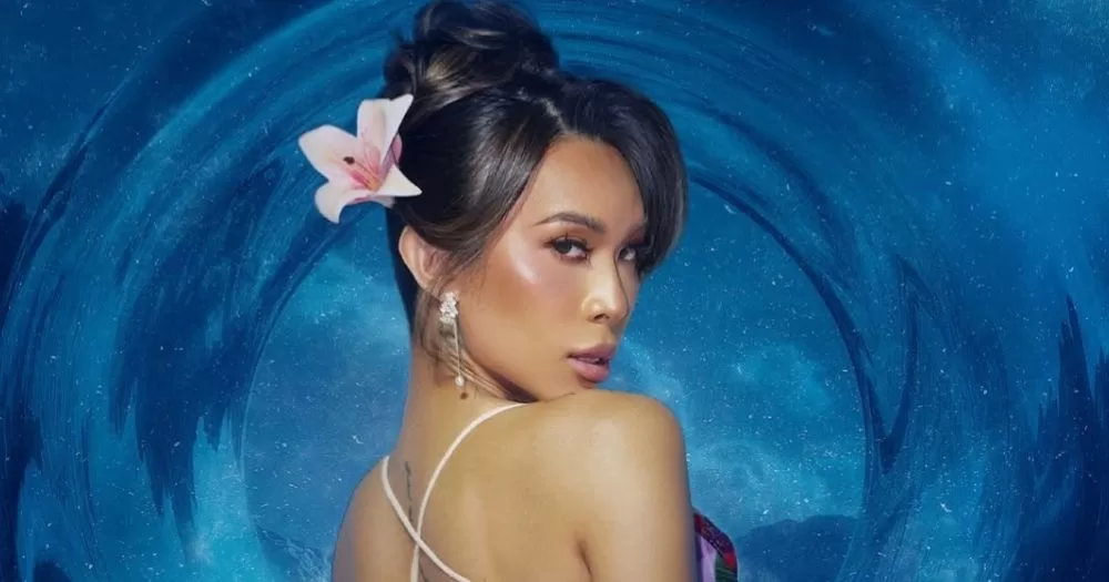 Miss Universe Philippines' 2026 host Marina Summers poses in front of a blue background.