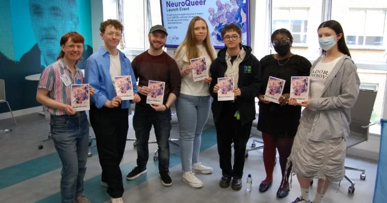 People posing for a photo at the launch of NeuroQueer, a new resource for neurodivergent LGBTQ+ people.