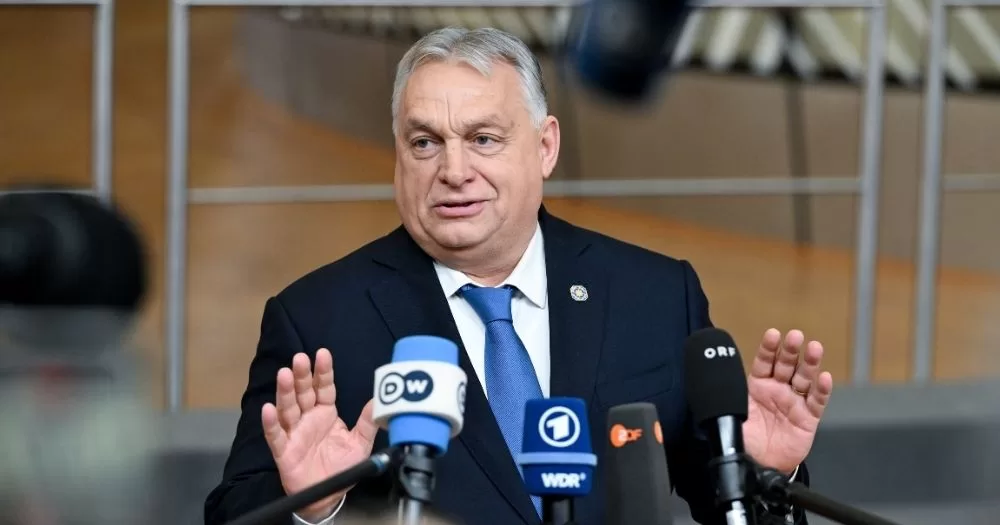 Hungarian Prime Minister Viktor Orbán, who has championed several laws against LGBTQ+ people, speaking to microphones during a press conference.