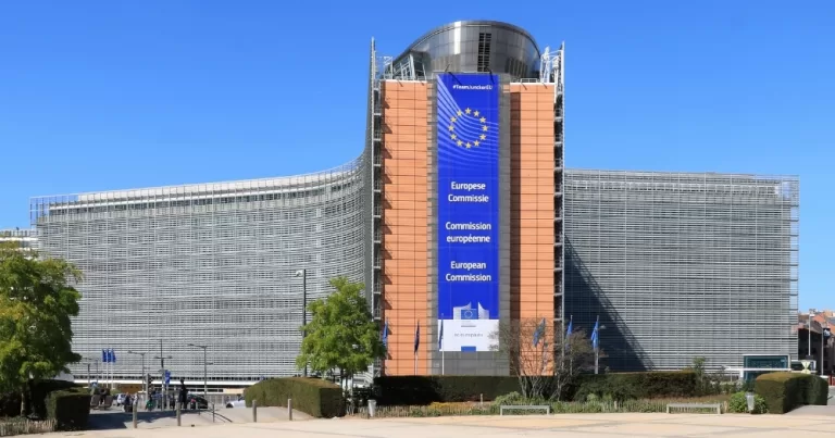 The building of the European Commission, which has not banned conversion therapy, with a banner that reads 'European Commission' in different languages.