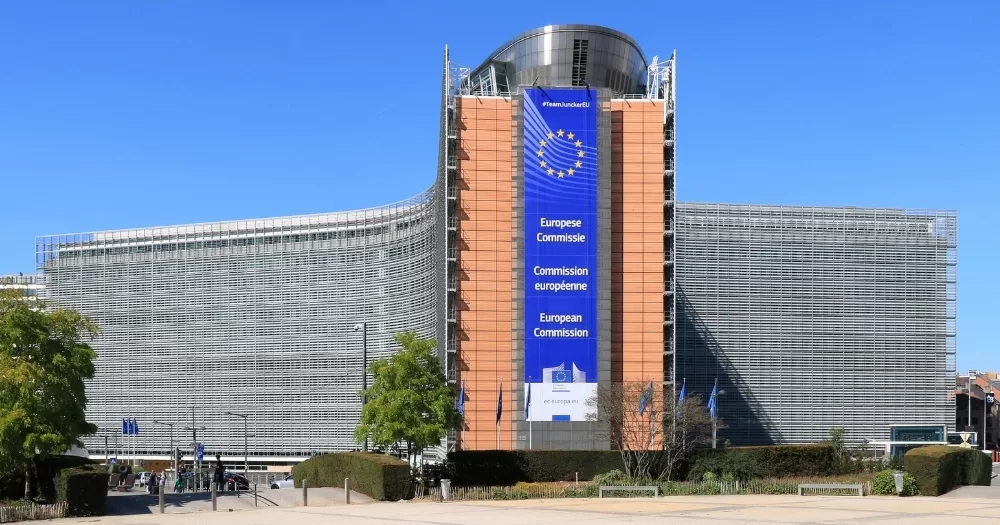 The building of the European Commission, which has not banned conversion therapy, with a banner that reads 'European Commission' in different languages.