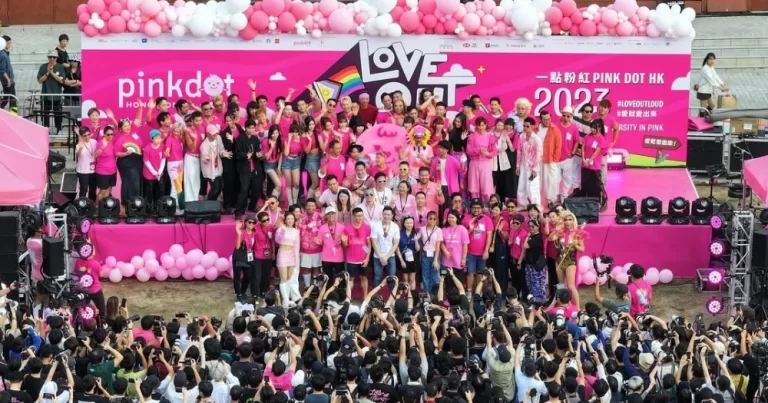 Photo taken at Hong Kong's LGBTQ+ festival Pink Dot HK, with participants wearing pink t-shirts and posing for a group picture.