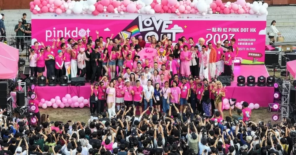 Photo taken at Hong Kong's LGBTQ+ festival Pink Dot HK, with participants wearing pink t-shirts and posing for a group picture.