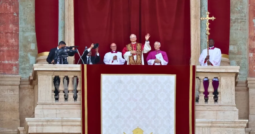 This article is about a Vatican report containing testimonies from gay men. In the photo, the Pope and cardinals on a balcony at the Vatican.