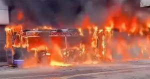 A bus set on fire during Belfast anti-immigration riots.