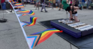 Pride flag bunting at an outdoor Pride event where a neo-Nazi group staged a demonstration.