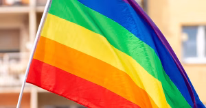 This article is about the Irish government's LGBTQ+ funding schemes. The image shows a rainbow flag.