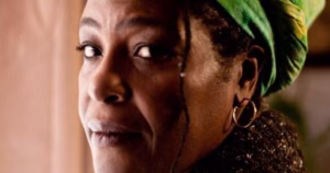 The article is about the announcement of the first black lesbian Othello, Sharon D Clarke. The image depicts Sharon D Clarke