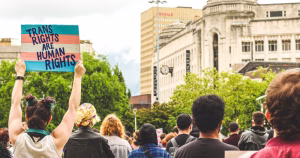 A trans rights protest. This article covers new UK guidances on trans people's access to single-sex spaces.