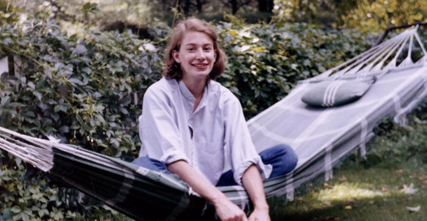 This image shows poet Mary Oliver sitting on a hammock.