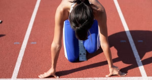 This article is about the US Supreme Court upholding state bans on trans women and girls from school sports. The image shows a person in the ready position for a track race.