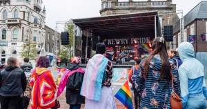 A crowd in front of a stage at Newry Pride.
