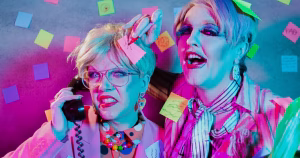 The article is about the Dublin Fringe Festival play Politics of Disgust. The promotional image depicts the two performers Constance Henry and Niall Keane in drag